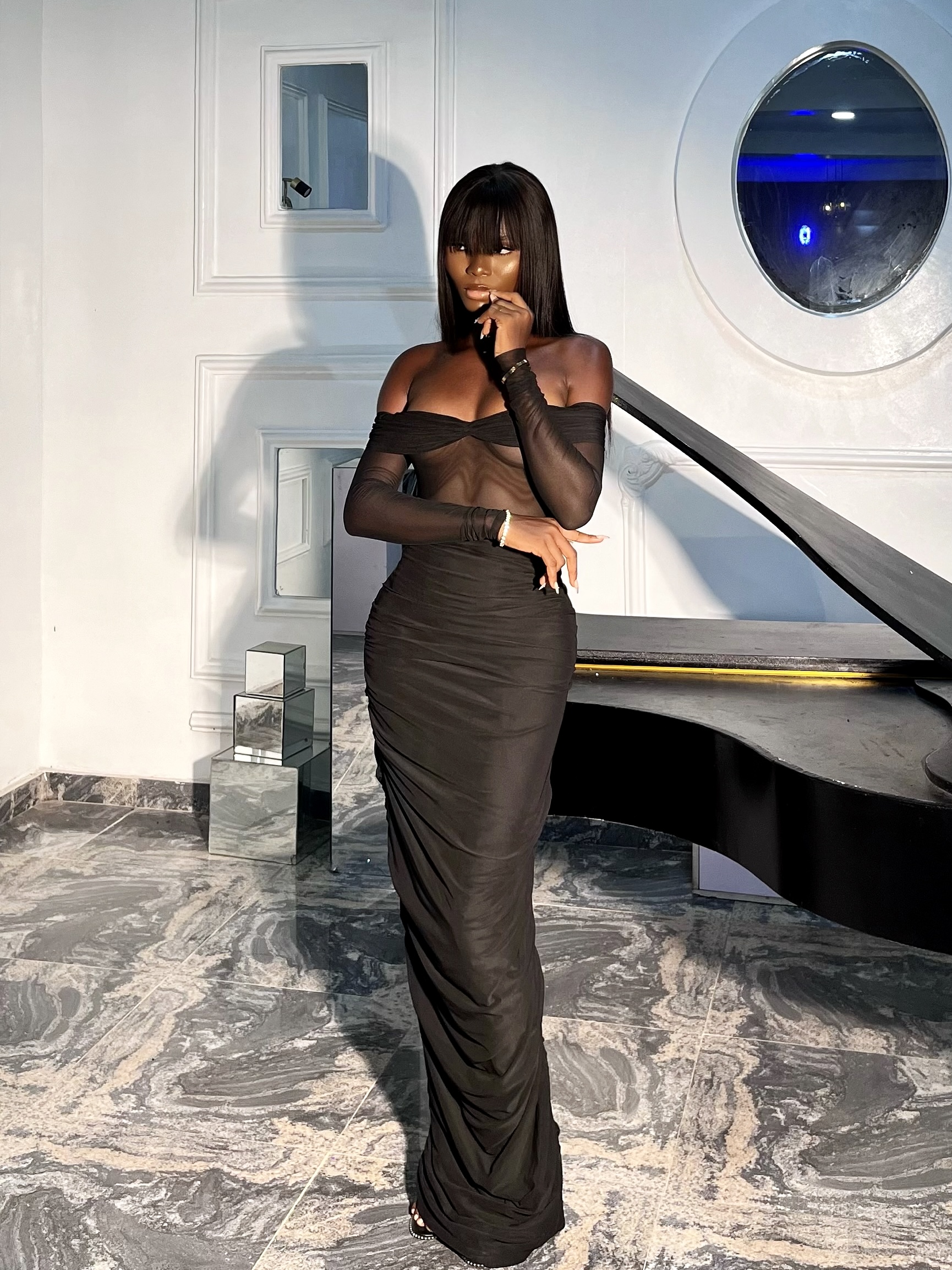 Midnight Draped Gown in the piano-room editorial